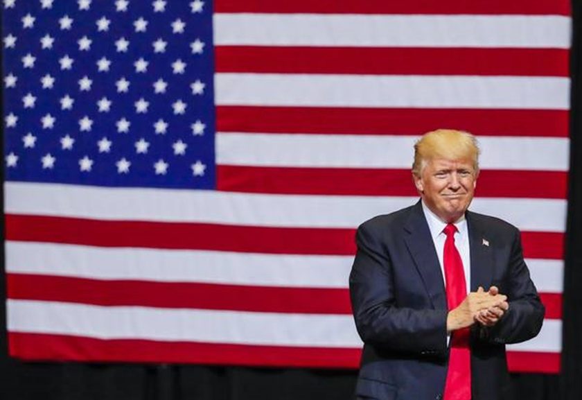 epa06042184 US President Donald J. Trump applauds as he arrives to a rally at the US Cellular Center in Cedar Rapids, Iowa, USA, 21 June 2017. Trump spoke on his idea to build a solar wall along the US Southern border and on renegotiating the North American Free Trade Agreement (NAFTA). EPA/TANNEN MAURY Donald Trump